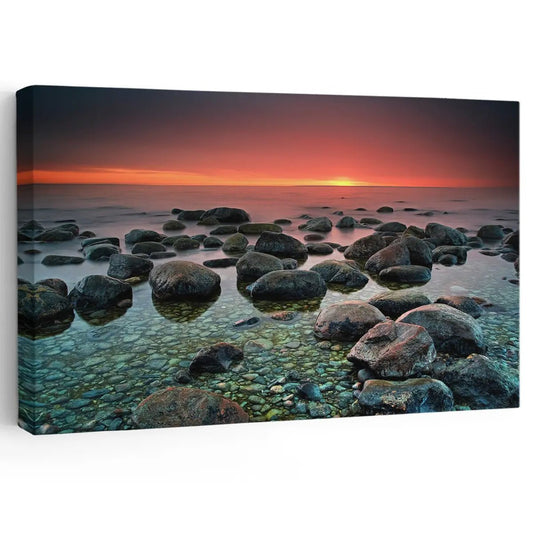 Rocky seascape at sunset coastal canvas print for living room — warm orange and teal tones create a peaceful ambiance