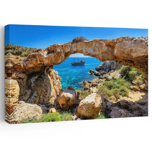 Ocean archway coastal canvas print for living room décor, adding a peaceful seaside mood with warm rocky textures and bright blue water