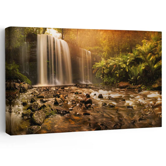 Golden forest waterfall canvas wall art for a peaceful living room, blending warm sunlight and nature tones to create a calming decorative atmosphere