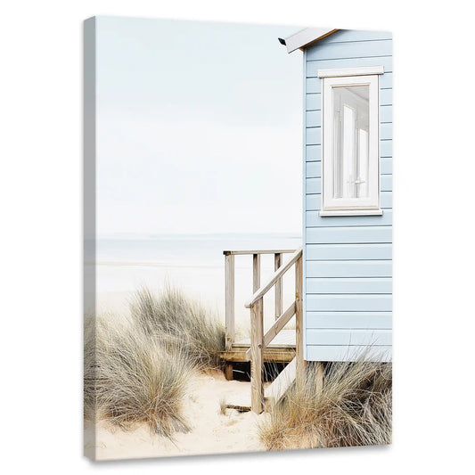 Pastel blue beach hut coastal canvas wall art for living room—serene seaside dunes with soft sky and minimalist coastal charm
