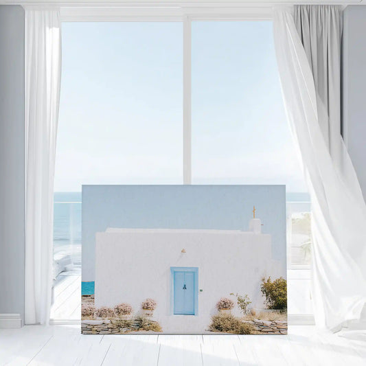 Whitewashed Greek house — large canvas wall art featuring soft sunlight and blue accents, peaceful island-style wall decor for bedroom design