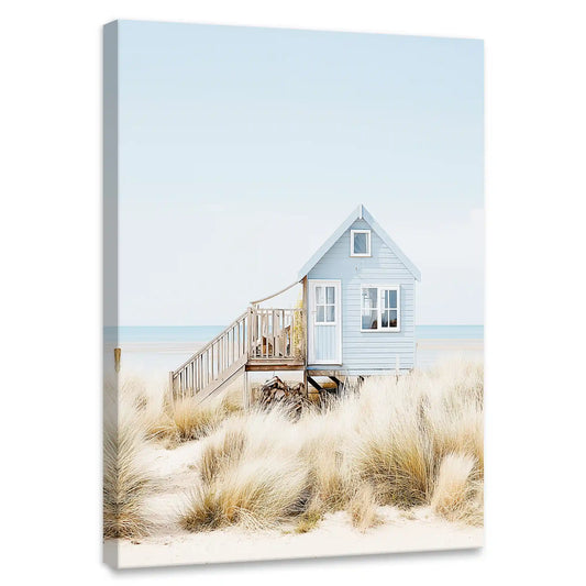 Pastel beach hut coastal canvas wall art for bedroom decor—peaceful dune scene with soft grasses and pale blue sky tones