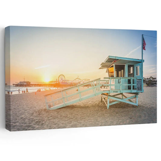 Santa Monica lifeguard tower canvas wall art for living room—warm sunset glow over beach sand with calming coastal seascape tones