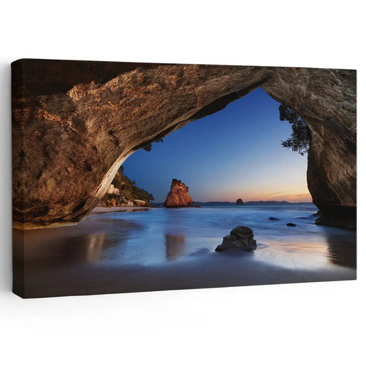 Sunset through ocean cave — large canvas wall art with twilight tones and serene seascape, calming wall decor for modern living room