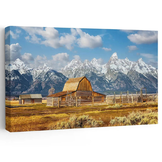 Rustic barn beneath snowy mountain peaks canvas wall art for creating a calming living room atmosphere with warm countryside charm