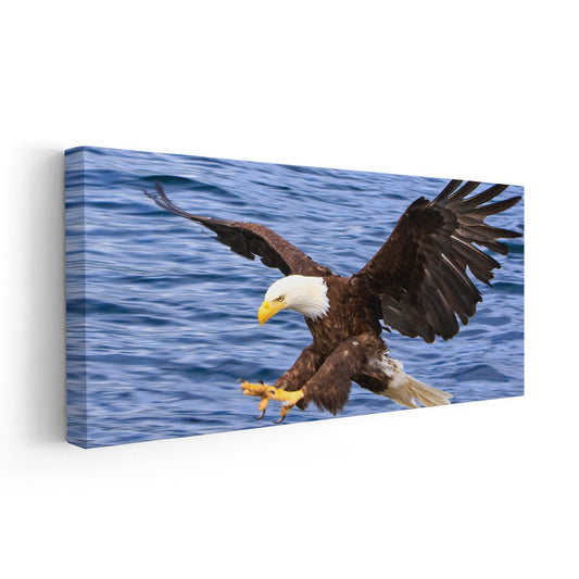 Soaring eagle above deep blue waves — large canvas wall art ideal for a modern office, creating an uplifting and adventurous atmosphere.