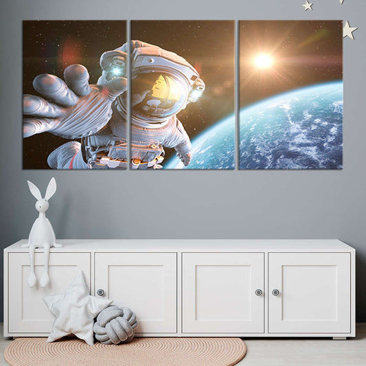 Modern space exploration theme orbiting astronaut — large canvas wall art, warm sunlight and cosmic shadows enhance office interiors