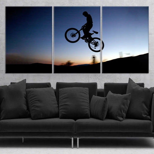 Mountain bike silhouette canvas wall art for living room decor, adding inspiring adventure energy with bold sunset contrasts for modern homes