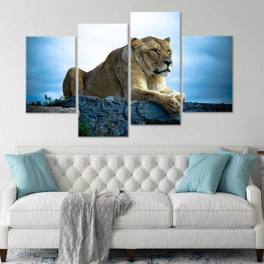 Lioness on rock canvas wall art for living room décor, adding inspiring wildlife strength and warm natural tones to modern styled spaces.