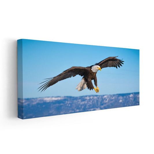 Majestic bald eagle soaring — modern canvas wall art, crisp blue palette bringing freedom and strength to living room or office décor.