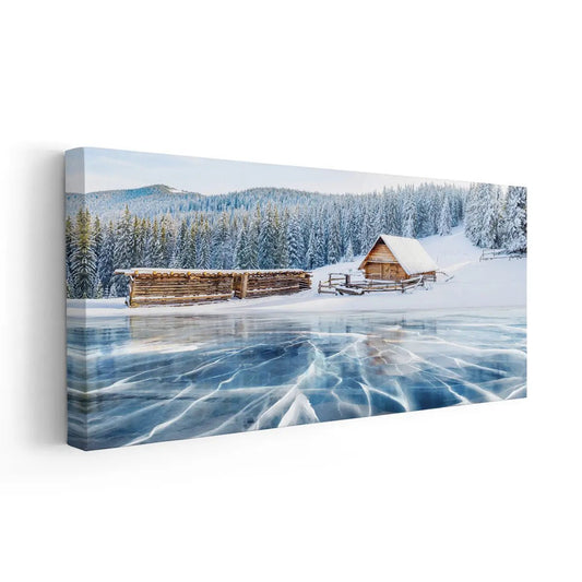 Winter wooden cabin on a frozen lake canvas wall art for a peaceful living room, adding calming icy tones and cozy rustic winter scenery