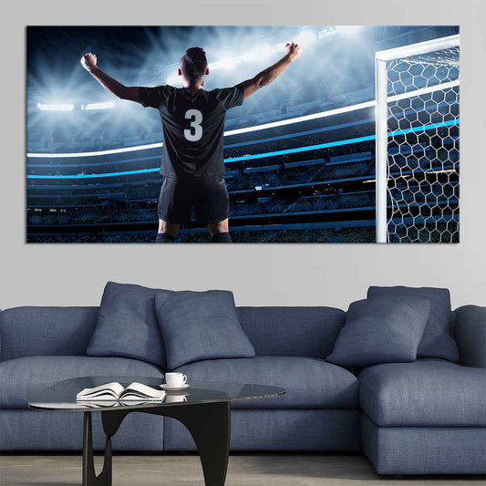 Victorious soccer player canvas wall art for living room décor, bringing inspiring stadium energy that makes a bold housewarming gift for fans