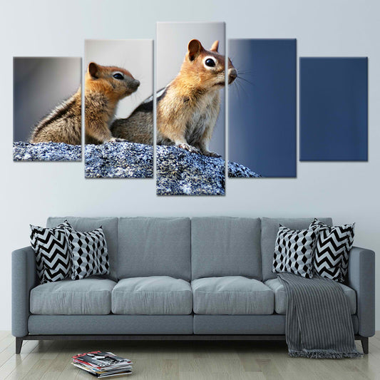 Mother and baby squirrel in snowy scene—canvas wall art for modern living room decor, adding an uplifting and heartwarming touch to cozy home spaces