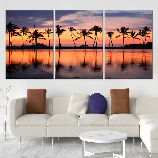Silhouetted palm trees at sunset — modern canvas wall art, calming orange and gold tones for serene beach interiors.