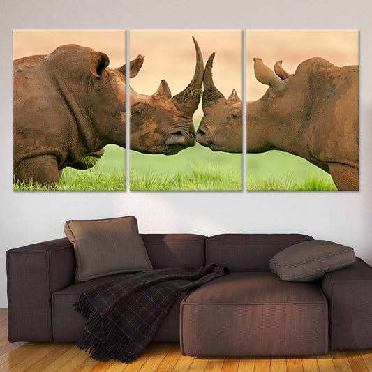 Rhinos face to face — large canvas wall art for living room, earthy tones symbolizing love and strength in wildlife-inspired décor.
