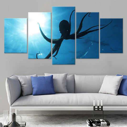 Octopus silhouette drifting in blue water—canvas wall art for modern living room decor, adding a peaceful coastal vibe and striking ocean presence