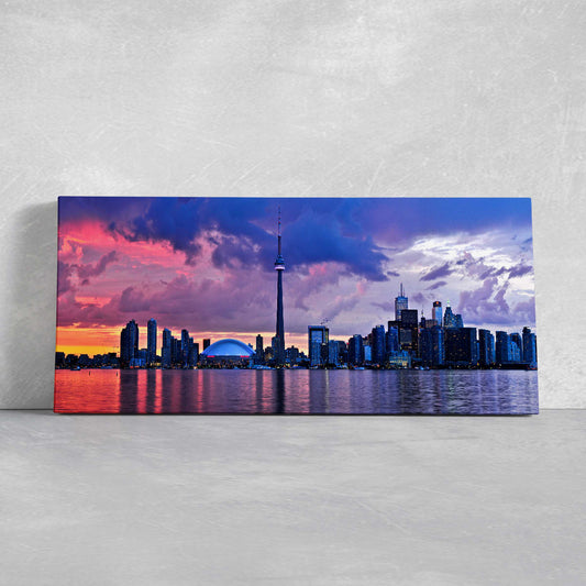 Toronto skyline at sunset — large canvas wall art with purple and orange hues, peaceful modern décor perfect for living room display.