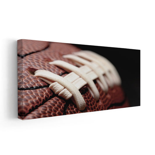Textured football leather in rustic warm tones — large canvas wall art ideal for office spaces seeking uplifting sports-themed décor