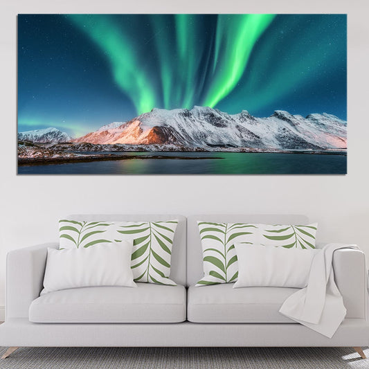 Vibrant northern lights above icy peaks — large canvas wall art, cool blue-green palette enhancing calm décor in modern living rooms.