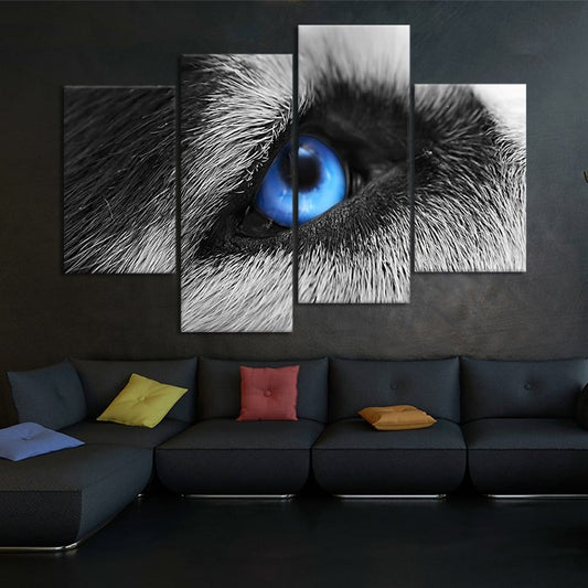 Wolf eye close-up — modern canvas wall art, striking blue tones symbolizing strength and mystery in a contemporary rustic setting.