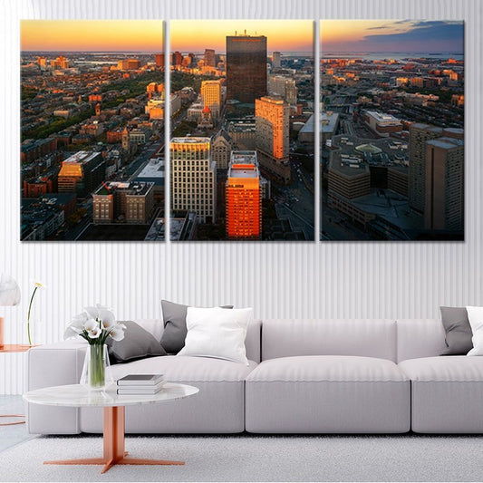 Boston skyline at sunset — large canvas wall art featuring warm orange and blue tones, modern décor centerpiece for elegant living rooms.