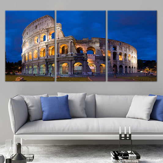 Roman Colosseum at dusk — large canvas wall art for living room, warm golden lights against deep blue sky create an inspiring décor.
