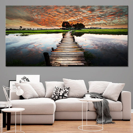 Sunset dock walkway overlooking glowing water Large canvas art adding a peaceful bedroom mood with dramatic evening sky and rustic charm