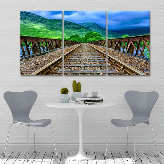 Scenic train track view leading to green mountains — large canvas wall art ideal for creating an inspiring focal point in any room