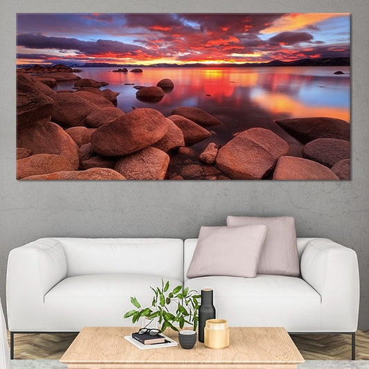 Sunset lake landscape with glowing reflections canvas wall art for creating a calming living room atmosphere with warm orange and blue tones