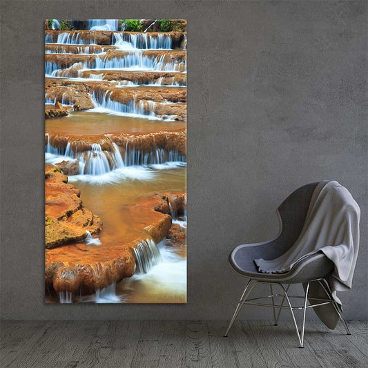 Serene tiered waterfall surrounded by warm forest tones — large canvas wall art ideal for creating an uplifting focal point at home