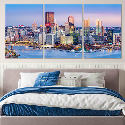 Pittsburgh skyline at sunset — modern canvas wall art for living room, golden and blue tones adding warmth and city charm.