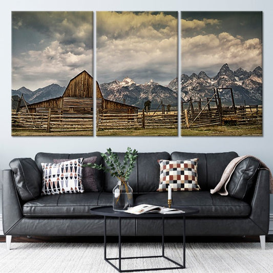 Rustic barn beneath stormy mountains canvas wall art for creating a calming living room atmosphere with timeless farmhouse charm