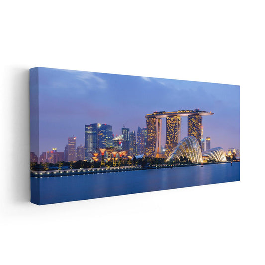 Singapore skyline at dusk — large canvas wall art for living room, glowing city lights reflecting on calm water for inspiring décor.