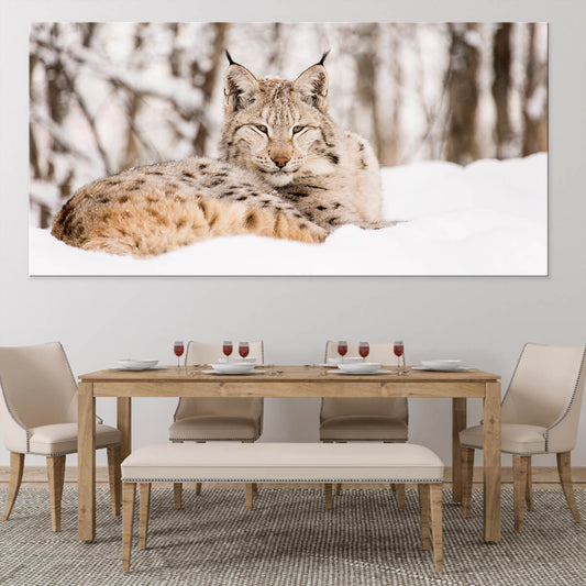 Snow lynx resting in winter scenery — canvas wall art for living room décor, adding a peaceful nature accent that elevates modern home styling.