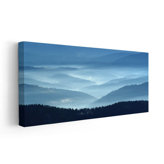 Blue misty mountains canvas wall art for a calming living room atmosphere, blending layered ridges with soft morning haze for peaceful decor.