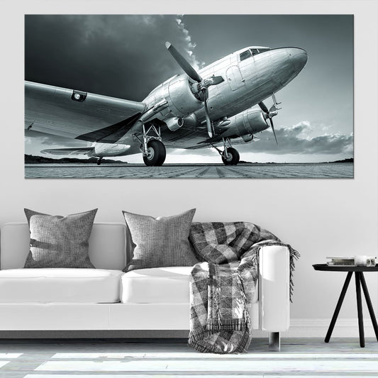 Vintage airplane in flight — elegant canvas wall art for living room, featuring sleek black-and-white aviation details.