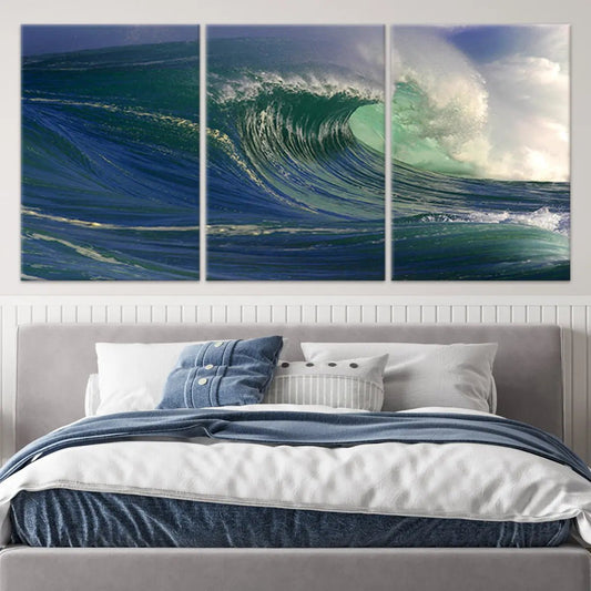 Blue wave crashing — coastal canvas print, modern seascape tones evoke ocean strength and serenity for contemporary beach interiors.