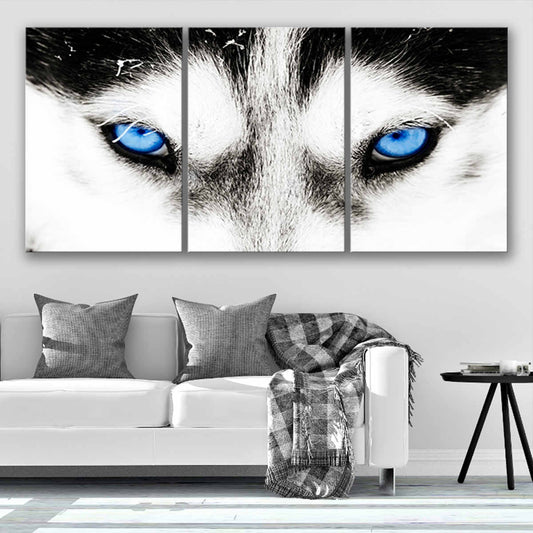 Wolf gaze with icy blue eyes — large canvas wall art for bedroom or office, inspiring power and determination daily.