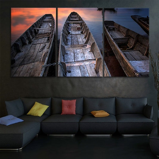 Rustic wooden canoe lineup — large canvas wall art, warm wood tones and quiet shoreline creating calming cabin decor