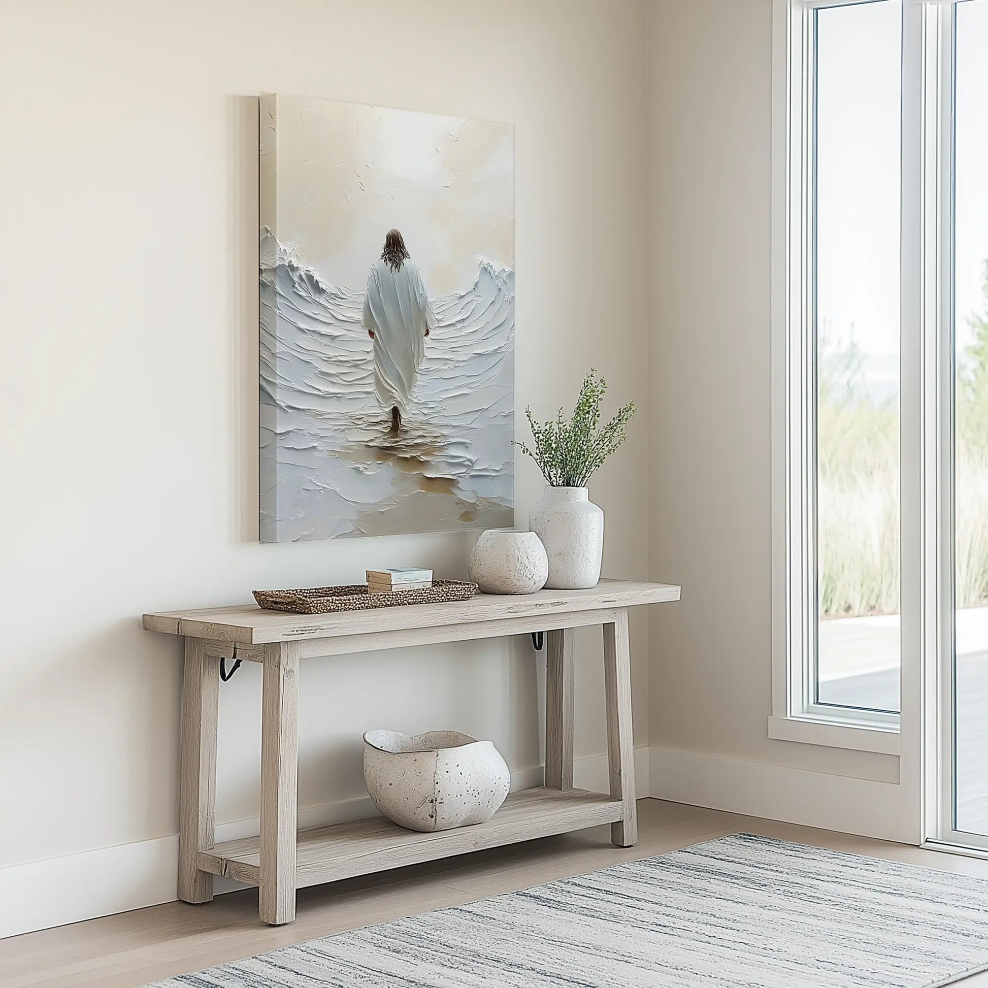 Modern Christian art of jesus walking on water artwork in a minimalist entryway above a neutral console table, enhancing the welcoming ambiance.