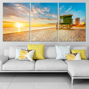 large Beach canvas wall art featuring a lifeguard tower on the shore at dawn.