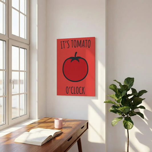 Graphic canvas wall art with a centered red tomato and stylized text reading 'IT'S TOMATO O'CLOCK' in a cheerful pop art style
