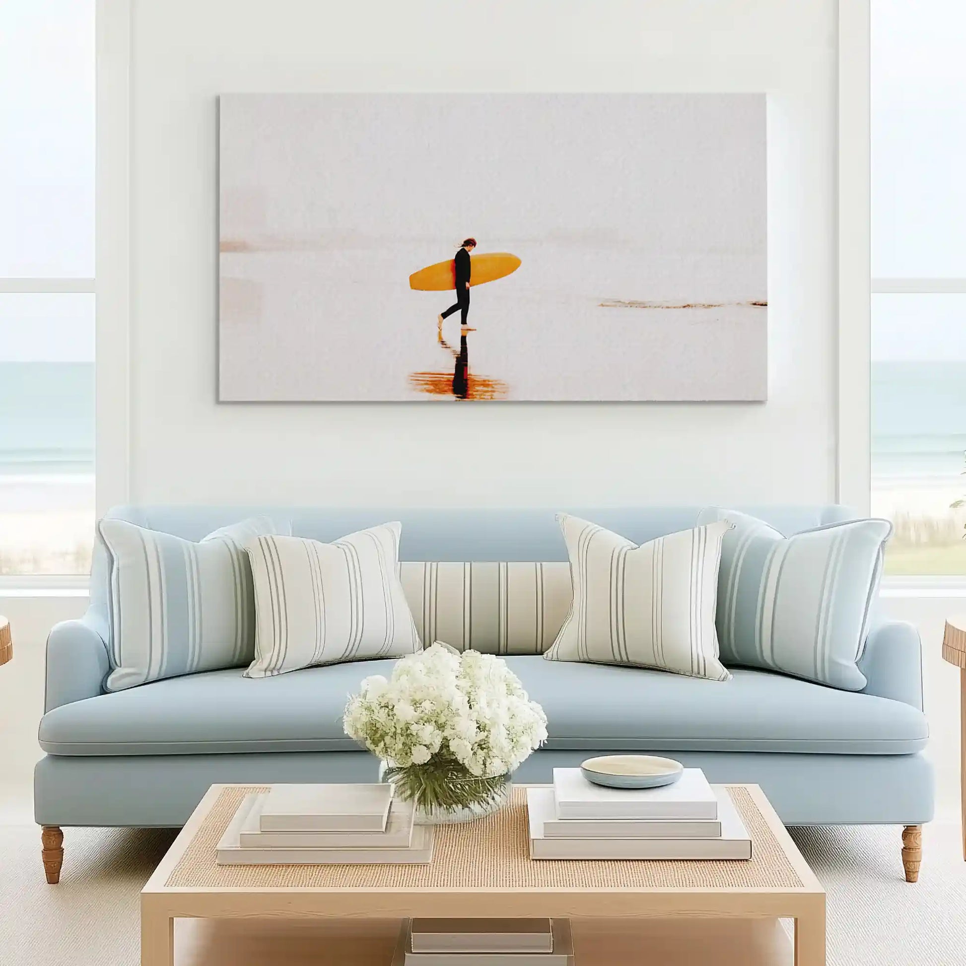 Tranquil beach painting with surfer complementing minimalist wall decor style