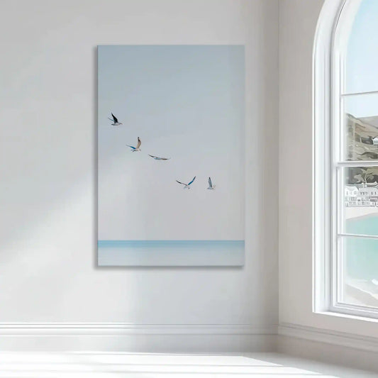 Light blue coastal wall art bringing calm and airy mood with birds in flight over serene water
