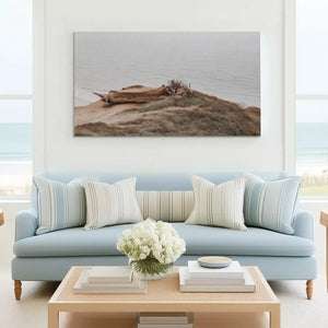 Tranquil shoreline painting complementing rustic wall decor with earthy seaside tones