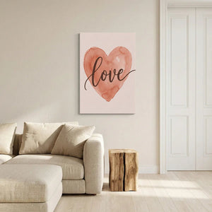 Watercolor canvas print showing a flowing heart design in soft pink and reddish-brown with handwritten-style lettering.
