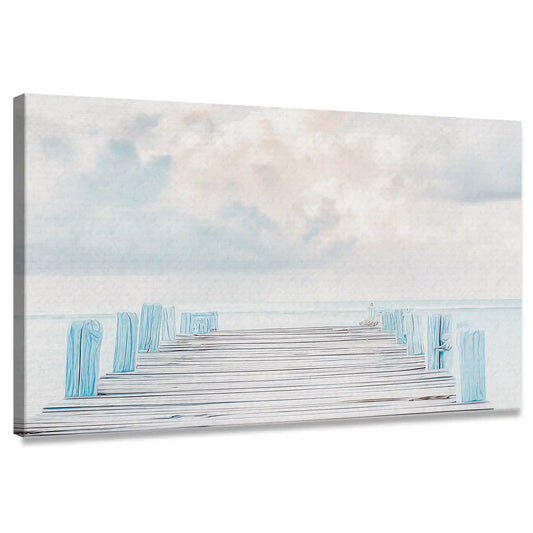 Coastal canvas wall art featuring wooden pier extending into soft blue ocean under cloudy sky