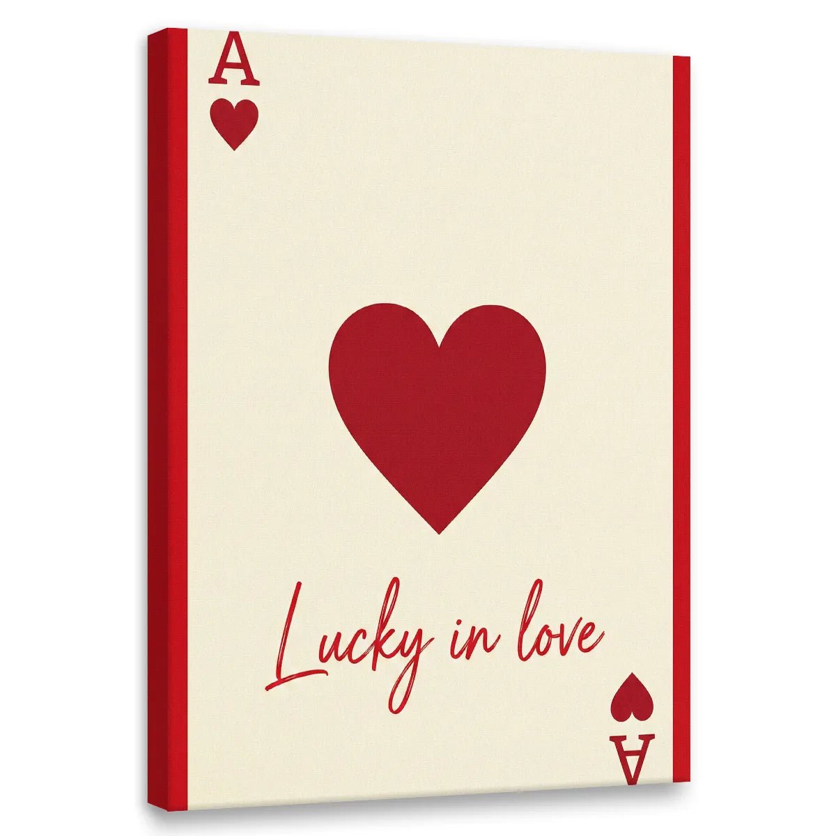 Minimalist canvas wall art featuring a bold red heart, stylized playing card elements, and the phrase 'Lucky in love' in red text.