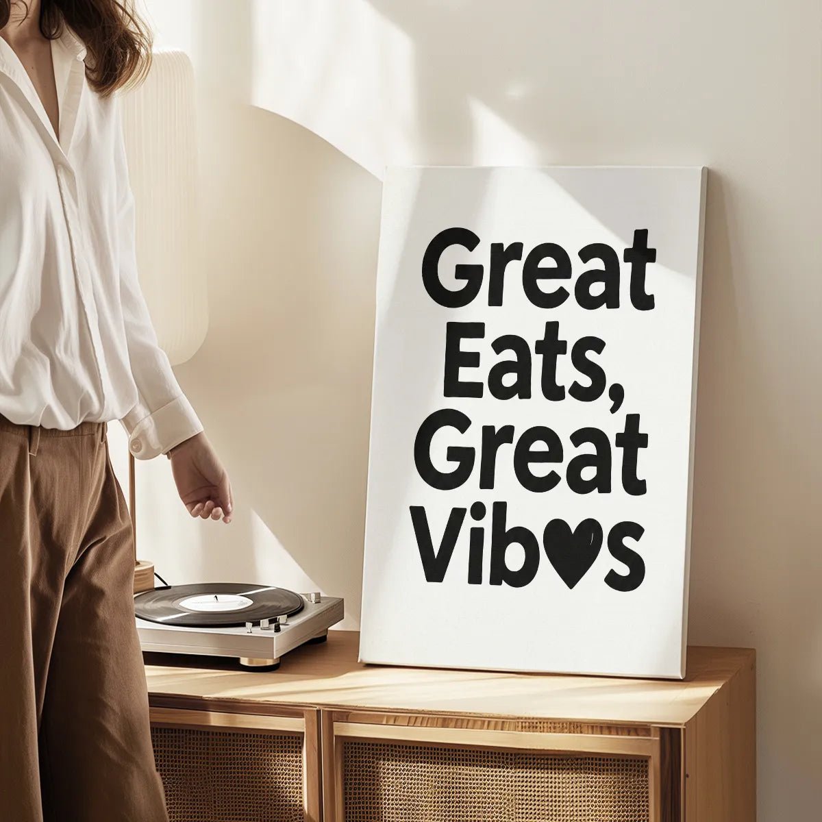 Canvas wall art print with bold typography and a heart replacing the 'e' in 'Vibes', set in a monochrome color scheme.