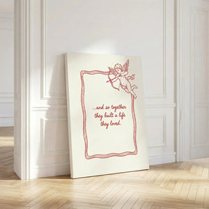 Gallery wrapped canvas with a centralized love quote and cupid detail in the top right corner, bordered by a wavy frame.